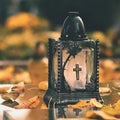 Beautiful autumn concept to the cemetery and Halloween. Candle in a lantern on the grave. Background for Halloween. Royalty Free Stock Photo