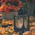 Beautiful autumn concept to the cemetery and Halloween. Candle in a lantern on the grave. Background for Halloween. Royalty Free Stock Photo