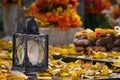 Beautiful autumn concept to the cemetery and Halloween. Candle in a lantern on the grave. Background for Halloween. Royalty Free Stock Photo