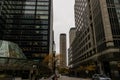 a beautiful autumn day in the city with skyscrapers, office buildings and hotels, autumn colored trees. people walking and cars Royalty Free Stock Photo