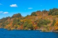 Beautiful autumn foliage scenery landscapes. View from Lake Towada sightseeing Cruise ship