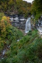 Beautiful fall forest landscape with idyllic waterfall Royalty Free Stock Photo