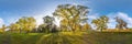 Beautiful autumn forest or park of oak grove with clumsy branches near river in gold autumn. hdri panorama with bright sun shining Royalty Free Stock Photo