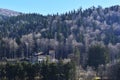 Beautiful autumn landscape with Cantacuzino Palace in the middle of Bucegi mountains forest, Busteni