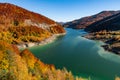 Beautiful autumn landscape with golden colored trees on the shores of Siriu lake