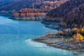 Beautiful autumn landscape with golden colored trees on the shores of Siriu lake