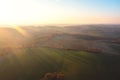 Beautiful autumn landscape, green fields, trees and the setting sun against the blue sky. Poland Royalty Free Stock Photo