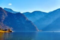 Beautiful autumn landscape of Hallstatt lake with boat and trees at sunny day in Austrian Alps, Salzkammergut region. Royalty Free Stock Photo