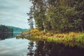 Beautiful autumn landscape with lake, pine trees, natural stone coast in the Republic of Karelia, Ladoga , northern