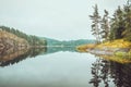 Beautiful autumn landscape with lake, pine trees, natural stone coast in the Republic of Karelia, Ladoga , northern Royalty Free Stock Photo