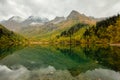 Beautiful autumn landscape, mountain lake, coniferous forest, mirror reflection. Russia, Kardyvach Royalty Free Stock Photo