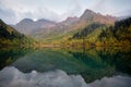 Beautiful autumn landscape, mountain lake, coniferous forest, mirror reflection. Russia, Kardyvach Royalty Free Stock Photo