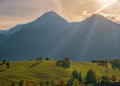 Beautiful autumn landscape in the mountains. Clouds illuminated by the morning sun floating low over the valley. Royalty Free Stock Photo