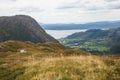 A beautiful autumn landscape of mountains in Folgefonna National park with fjord far in the distance. Fall scenery of southern Nor