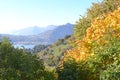 Beautiful autumn landscape in the mountains with yellow trees in the foreground. Royalty Free Stock Photo