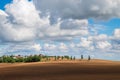 Beautiful autumn landscape with plowed field under blue sky with clouds Royalty Free Stock Photo
