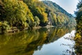 Beautiful autumn landscape is reflected in the mirror mountain river Psekups. Sunny day in esort area with Cockerel rock Royalty Free Stock Photo