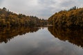 Beautiful autumn landscape. Reflection of the sky and trees in the lake. Royalty Free Stock Photo
