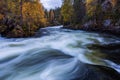 Beautiful autumn landscape with the river and bridge, Oulanka National park, Finland Royalty Free Stock Photo