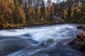 Beautiful autumn landscape with the river and old building, Oulanka National park, Finland Royalty Free Stock Photo