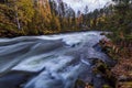 Beautiful autumn landscape with the river and old building, Oulanka National park, Finland Royalty Free Stock Photo