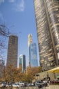 A beautiful autumn landscape with skyscrapers, hotels, and office buildings in the city skyline, autumn trees, cars driving Royalty Free Stock Photo