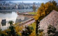 Beautiful autumn landscape, view of the Danube river Petrovaradin fortress and Novi Sad on cloudy rainy day Royalty Free Stock Photo