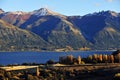 poplar autumn landscape with yellow trees on the river bank and mountain range in a sunny afternoon.san martin de los andes , Royalty Free Stock Photo