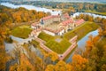 Beautiful autumn landscape. Yellow trees shed their foliage. Nesvizh Castle from above Royalty Free Stock Photo