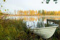 Beautiful autumn morning landscape with old rowing boat and Kymijoki river waters. Finland, Kymenlaakso, Kouvola Royalty Free Stock Photo