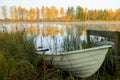 Beautiful autumn morning landscape with old rowing boat and Kymijoki river waters. Finland, Kymenlaakso, Kouvola Royalty Free Stock Photo