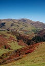 Beautiful autumn mountain landscape with colorful trees, snow peaks and old houses. Traveling through the mountains of Georgia Royalty Free Stock Photo