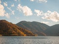 Beautiful autumn mountain landscape and lake with blue sky Royalty Free Stock Photo