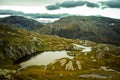 A beautiful autumn mountain landscape with a small lake. Natural scenery in Norwegian mountains. Royalty Free Stock Photo