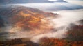 Beautiful Autumn mountain panorama. Landscape with meadow and colorful forest. Red, Yellow, Orange trees on hillsides Royalty Free Stock Photo