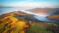 Beautiful Autumn mountain panorama. Morning thick fog cover valley aerial view. Fantastic fall sunrise Royalty Free Stock Photo