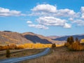 Beautiful autumn mountain road, cars on the highway Royalty Free Stock Photo