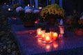 Beautiful autumn night concept. Cemetery and Halloween. Candle in the grave. Background for Halloween. Royalty Free Stock Photo