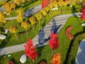 Beautiful autumn park with yellow orange trees and leaves, landscape design Autumn streets city Dnipro, Ukraine, leaf fall. Drone Royalty Free Stock Photo