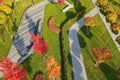 Beautiful autumn park with yellow orange trees and leaves, landscape design Autumn streets city Dnipro, Ukraine, leaf fall. Drone Royalty Free Stock Photo