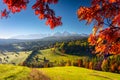 Beautiful autumn with a red and yellow trees under the Tatra Mountains at sunrise. Slovakia Royalty Free Stock Photo