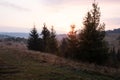 Beautiful autumn rural landscape with mountain and trees over amazing colors sky Royalty Free Stock Photo