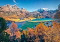 Beautiful autumn scene of Silvaplana village, Maloja Region. Aerial morning view of Swiss Alps with Piz Surlej peak on background.