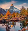 Beautiful autumn scenery. Astonishing sunrise on Grindjisee lake, Swiss Alps, Zermatt resort location, Royalty Free Stock Photo