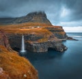 Beautiful autumn scenery. Dramatic morning scene of Mulafossur Waterfall.