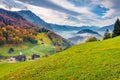 Beautiful autumn scenery. Misty morning view of outskirts of Stansstad town, Switzerland,