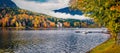 Panoramic autumn view of Grundlsee lake with small yacht. Royalty Free Stock Photo