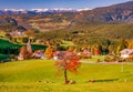 Beautiful autumn scenery of San Michele and Castelrotto villages. Dolomite Alps, South Tyrol, Italy