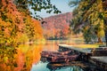 Beautiful autumn scenery. Stunning morning view of pure water lake with boats in Plitvice National Park. Royalty Free Stock Photo