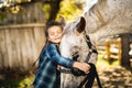 In a beautiful Autumn season of a young girl and horse